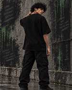 RUZE Against Doubt black oversized T-shirt — front graphic detail close-up embroidery and print