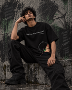 RUZE Against Doubt heavyweight black oversized tee — male walking lifestyle front view