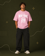 District 28 baby pink oversized T-shirt on female model – front full-body